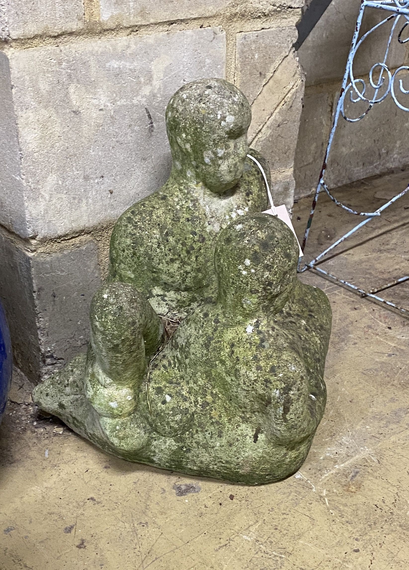 A reconstituted stone figural garden ornament, height 40cm